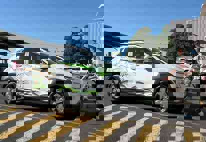 Girl charging Transgrid electric car