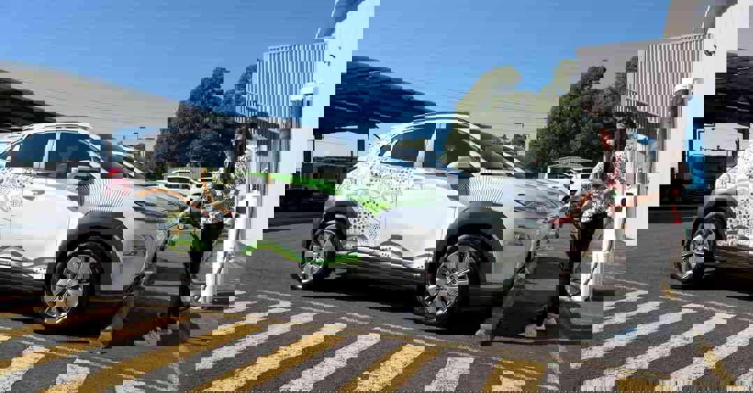 Girl charging Transgrid electric car