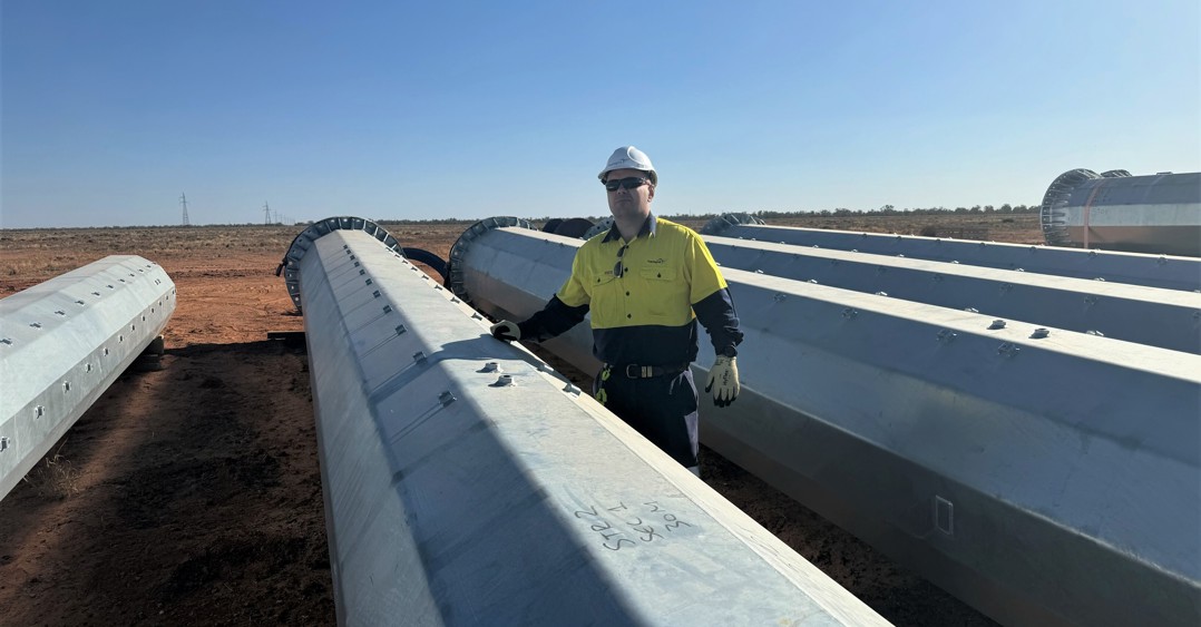 Transgrid Head of Far West Operations Response Sam Pickering inspects the steel structures at Broken Hill
